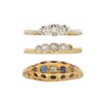A selection of three diamond set rings.