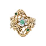A 9ct modern Art Nouveau style diamond and emerald set dress ring.