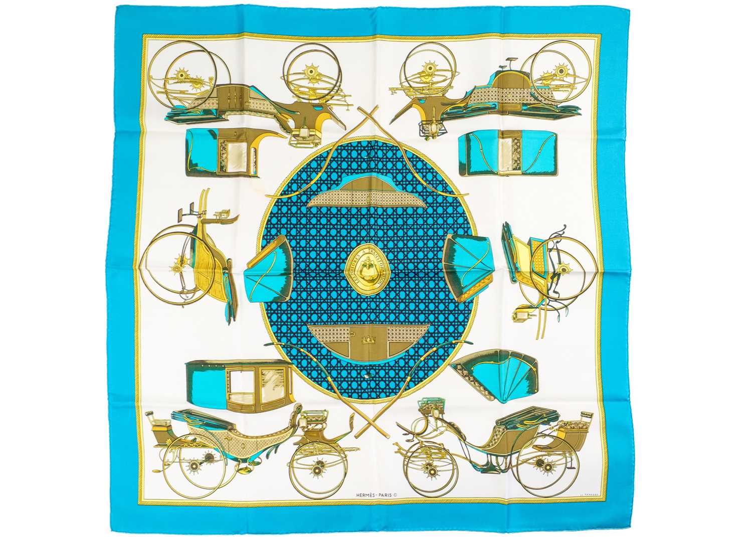 HERMES - A silk scarf in 'Les voitures a transformation' pattern designed by La Perriere.