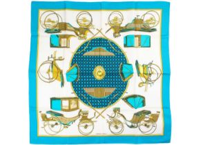 HERMES - A silk scarf in 'Les voitures a transformation' pattern designed by La Perriere.