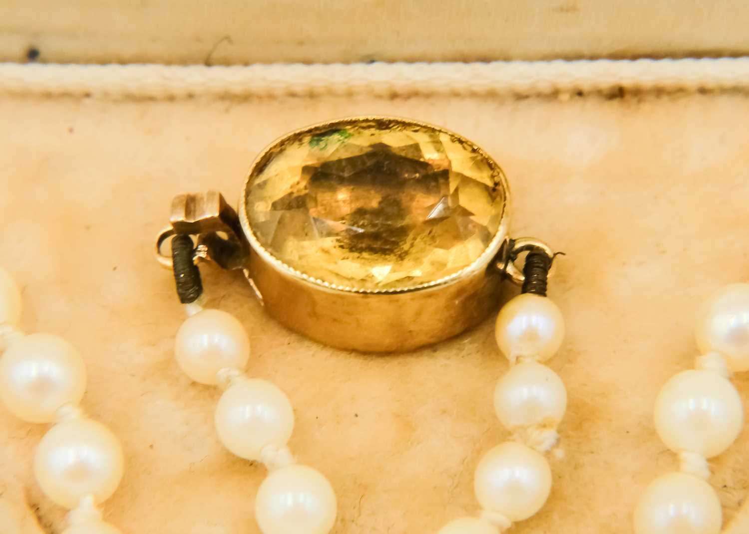 A graduated cultured pearl necklace with 14ct (tested) citrine set clasp. - Image 5 of 5