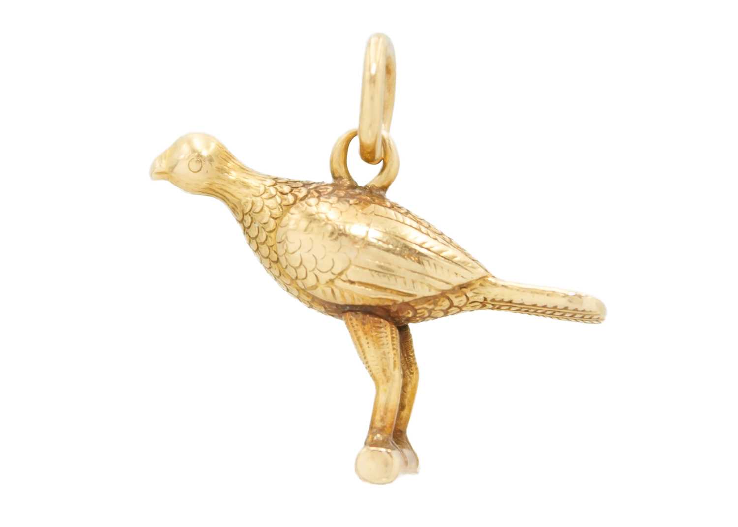 A high purity gold (tests 18ct) bird on a perch charm pendant. - Image 2 of 2