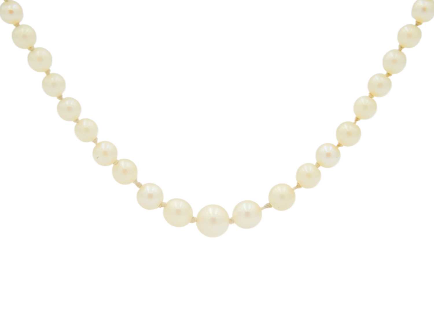 A graduated cultured pearl necklace with 14ct (tested) citrine set clasp.
