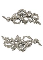 Harold A Lazarus - A pair of silver clear paste set foliate design brooches.