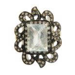 A silver and gilt emerald cut aquamarine and diamond set dress ring.