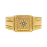 A heavy 18ct gentleman's signet ring star set with a small diamond.