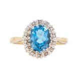 A 9ct blue topaz and diamond set cluster ring.