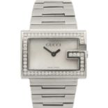 A Gucci lady's stainless steel diamond set quartz bracelet wristwatch.