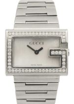 A Gucci lady's stainless steel diamond set quartz bracelet wristwatch.