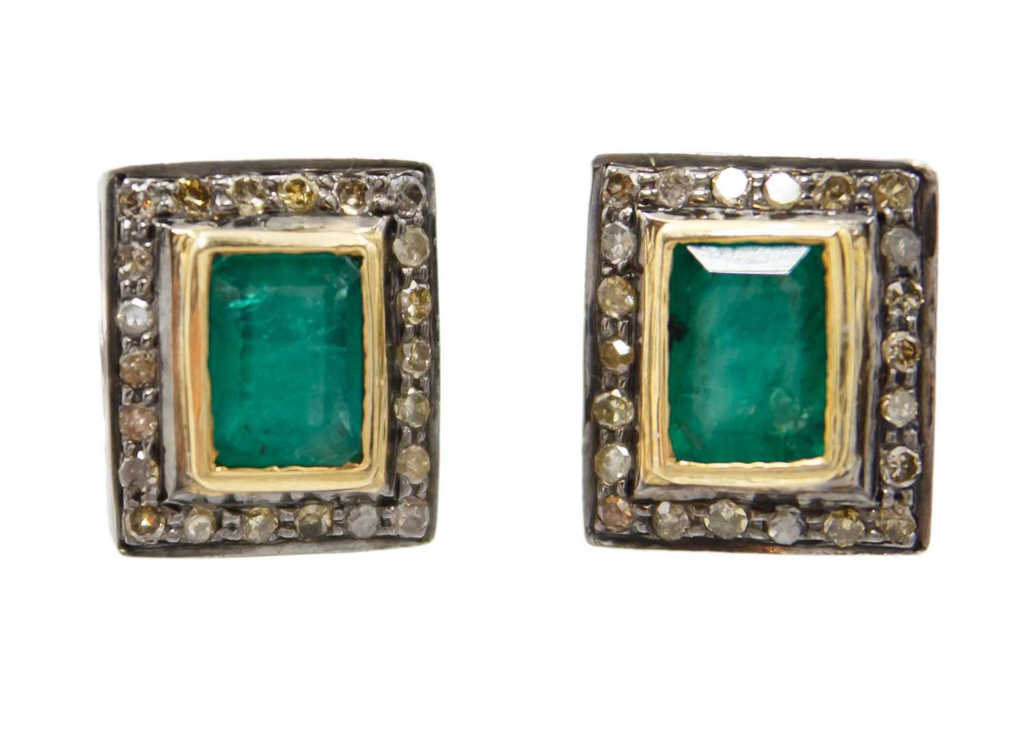 A pair of silver and silver gilt emerald and diamond set cufflinks.