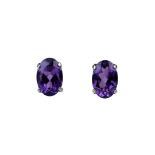 A pair of platinum amethyst set stud earrings, and a pair of loose moissanite gems.