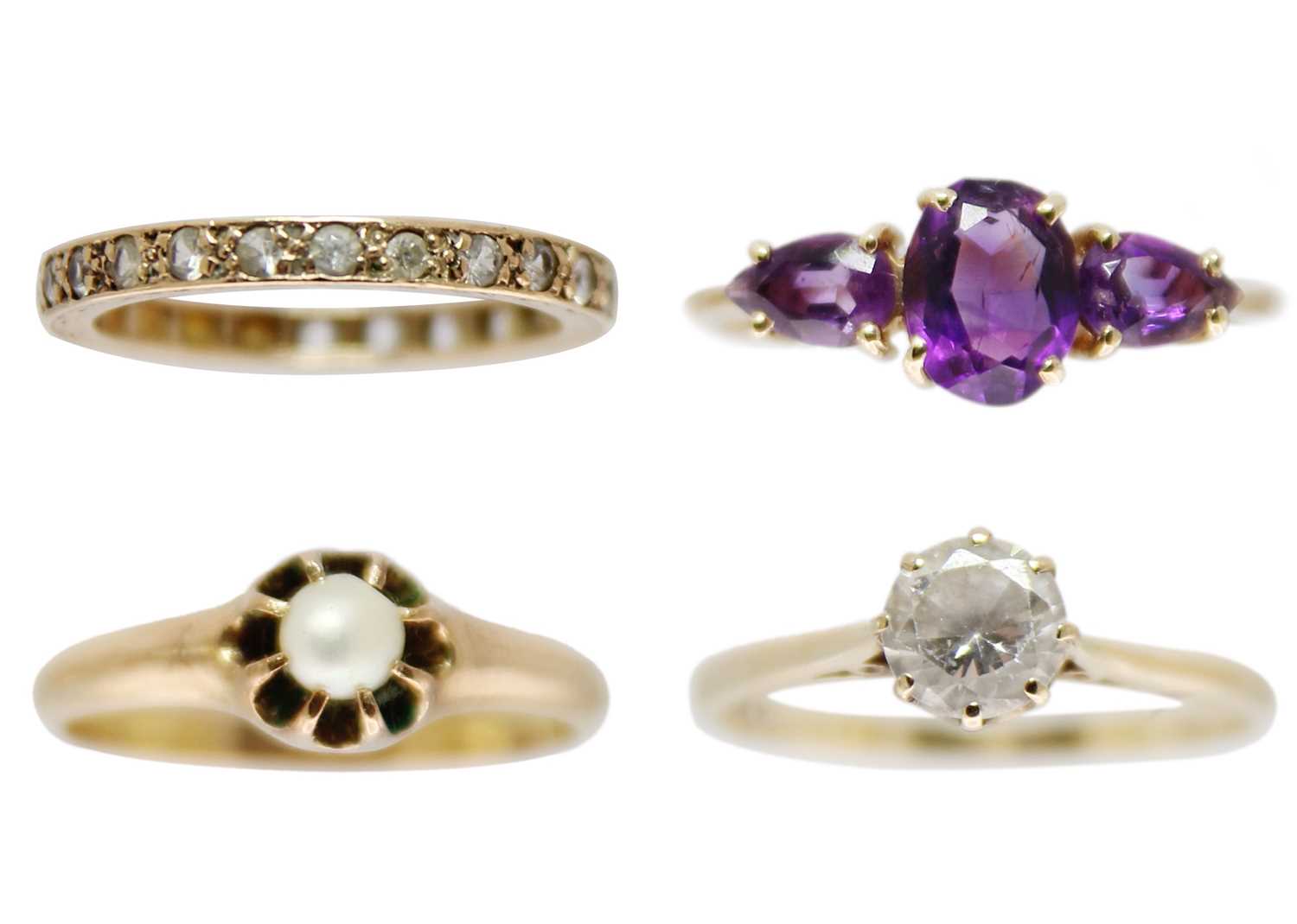 A selection of four gem set rings.
