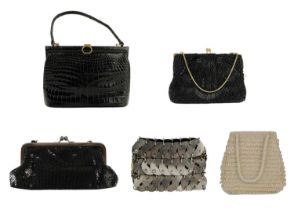 A vintage Gucci crocodile skin black handbag and four other bags.