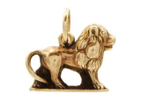 A high purity gold (tests 18ct) lion charm pendant.