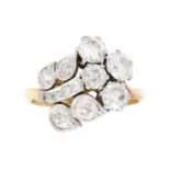 An exquisite Art Deco 18ct gold and platinum diamond set floral design ring.