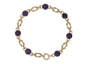 A 9ct amethyst set twist link design bracelet.