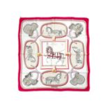 HERMES - A printed silk scarf in 'Grand Apparat' pattern.