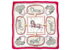 HERMES - A printed silk scarf in 'Grand Apparat' pattern.