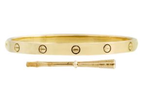 CARTIER - An 18ct love bangle with a screwdriver and original box and bag.