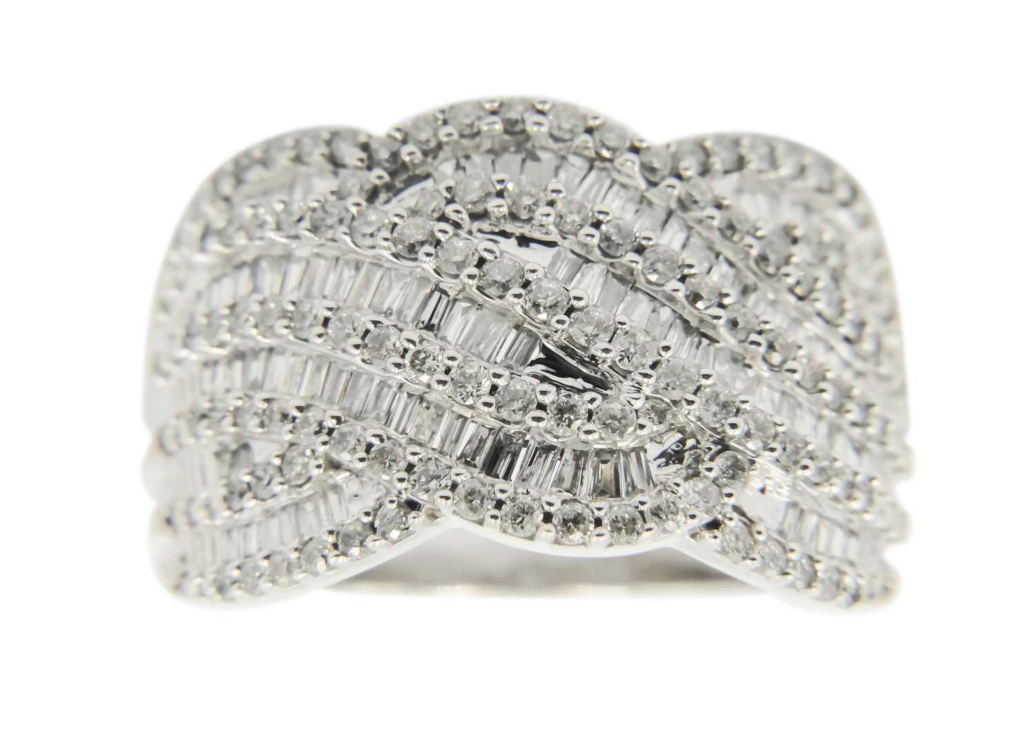 A 9ct white gold diamond set wave design dress ring.