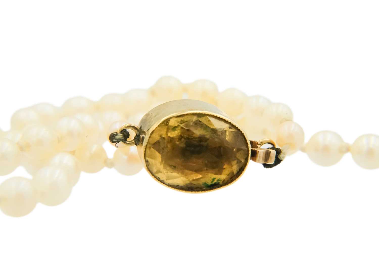 A graduated cultured pearl necklace with 14ct (tested) citrine set clasp. - Image 3 of 5
