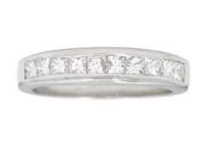 An 18ct white gold diamond set half eternity ring.