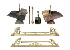 Two Victorian brass fenders.