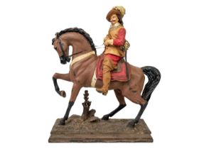 A painted spelter figure of a Cavalier on horseback.