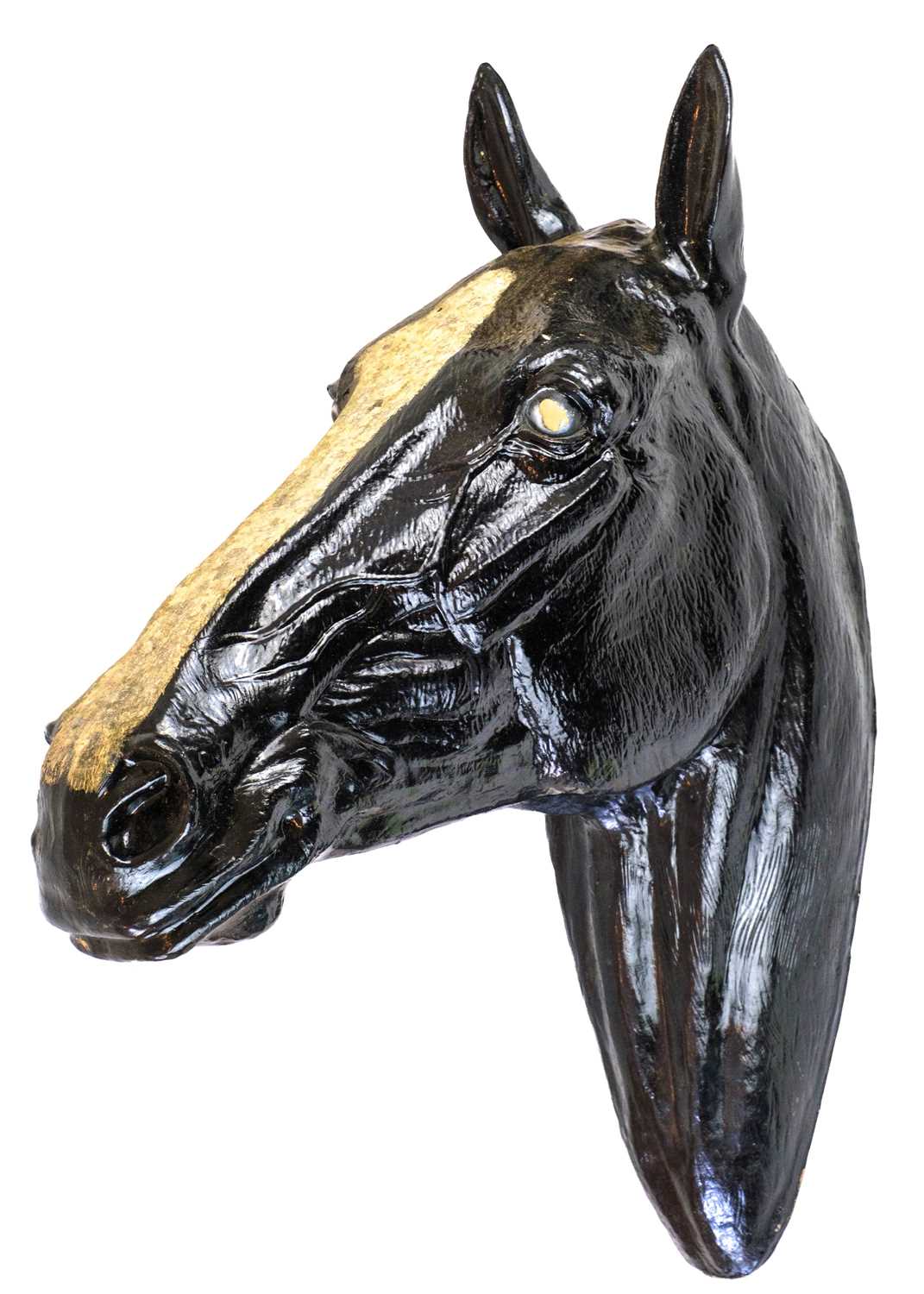 A life sized fibre glass model of a horses head.