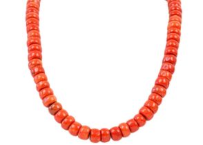 A Tibetan red coral bead necklace.