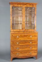 A Georgian mahogany secretaire bookcase with moulded cornice, fitted adjustable shelves enclosed