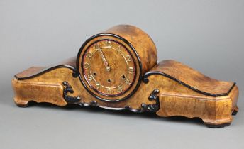 An Art Deco chiming mantel clock with gilt Arabic numerals, contained in a figured walnut Admiral'