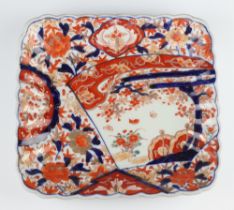 A 19th Century Chinese Imari square dish decorated with panels of flowers and insects (cracked) 26.