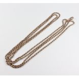 A yellow metal muff chain 132cm, 27.3 grams