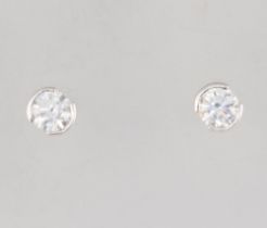 A pair of white metal stamped 750 brilliant cut diamond ear studs, approx. 0.3ct each, 1.5 grams