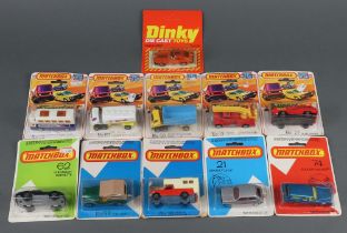 A Dinky Datsun 280Z no.106 model car together with 10 Match Box cars in plastic bubbles on card,