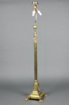 A 19th Century brass adjustable oil lamp raised on a Corinthian column capital with reeded column,