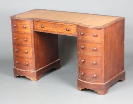 A Victorian mahogany dressing table with inset surface above 1 long and 8 short drawers with