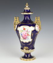 A Royal Crown Derby 2 handled oviform vase, the blue ground with panels of flowers having pierced
