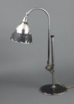 A Bestlite anglepoise lamp on a circular base 62cm x 22cm Some paint loss in places
