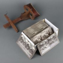 A stereoscopic viewer together with 64 First World War realistic travellers stereoscopic cards