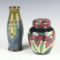 A modern Moorcroft baluster vase and cover decorated the trillium flower pattern dated 2000 together