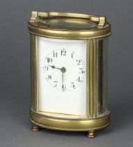 A 20th Century French 8 day carriage timepiece with enamelled dial Arabic numerals contained in an