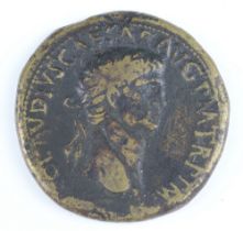 A brass sestertius coin for Claudius, Rome 41/2AD, the reverse shows an oak-wreath containing four