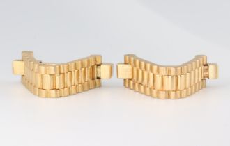 A pair of French Mecan Elde yellow metal Rolex bracelet style stirrup cufflinks, 20.5 grams