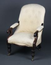 A William IV mahogany open arm chair upholstered in white buttoned material, raised on turned