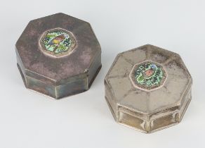 A pair of octagonal silver and enamelled boxes decorated with parrots, numbered 84A of 500 and 84B