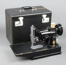 A Singer 222K featherweight sewing machine boxed