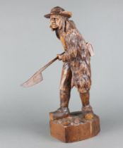 A carved wooden figure of a standing "Pikeman" with pike 53cm h x 20cm w x 12cm d Damage to hat