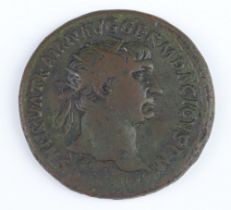 A bronze dupondius coin for Trojan Rome 101AD, the reverse side shows Justitia seated on a chair